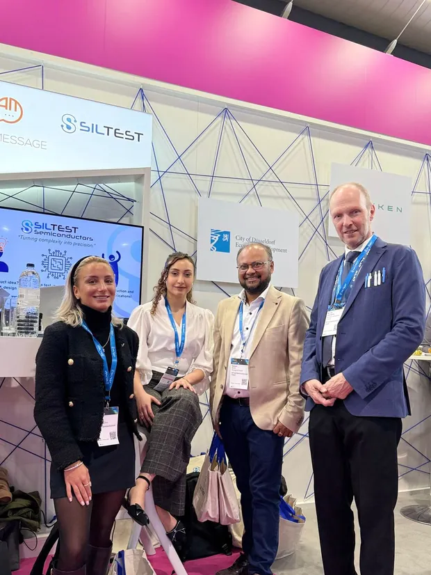 The team with clients at an exhibition stand